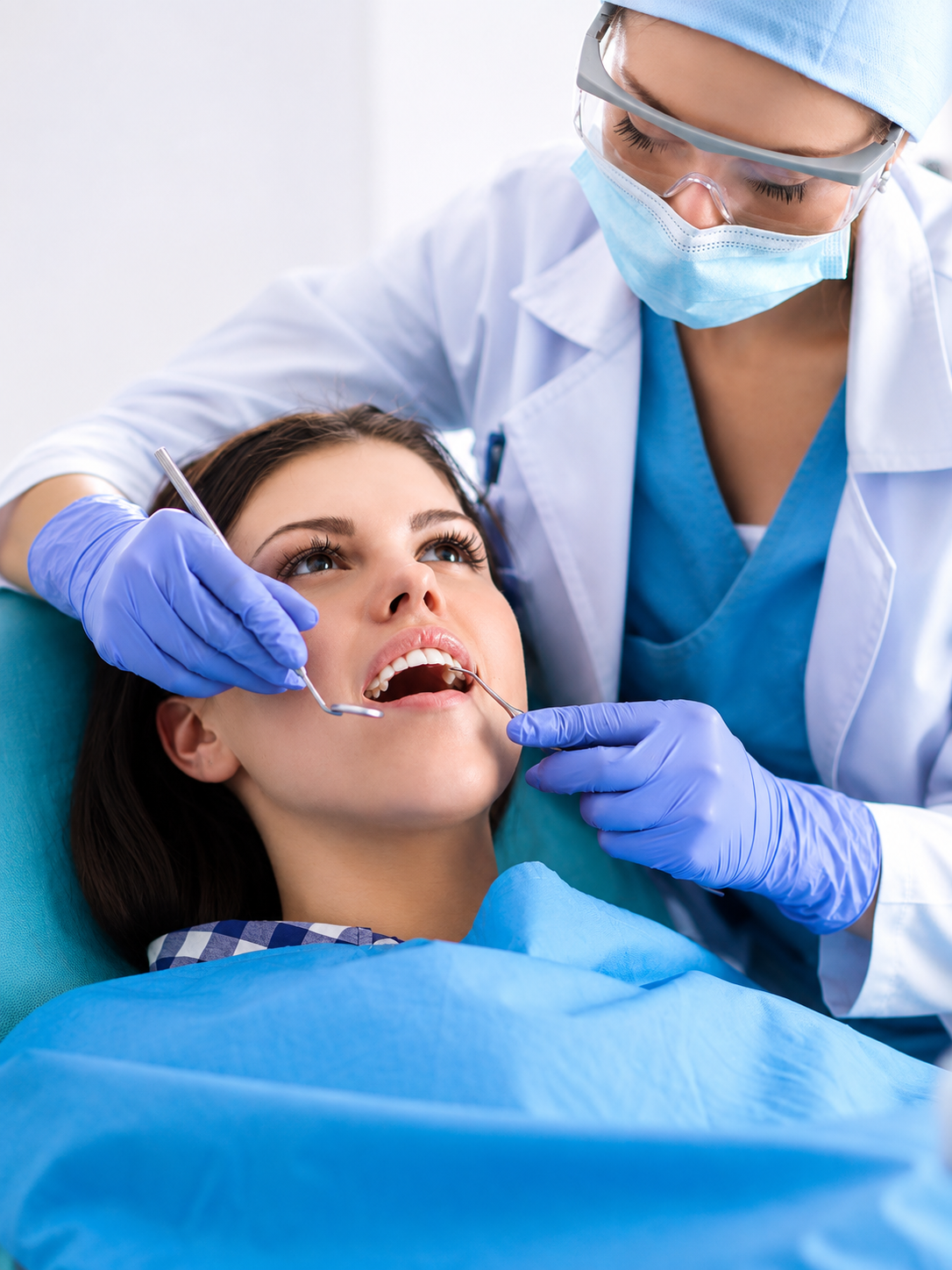 Dentist at Krishna's Dant Ayush treating a patient in Madhapur, Hyderabad
